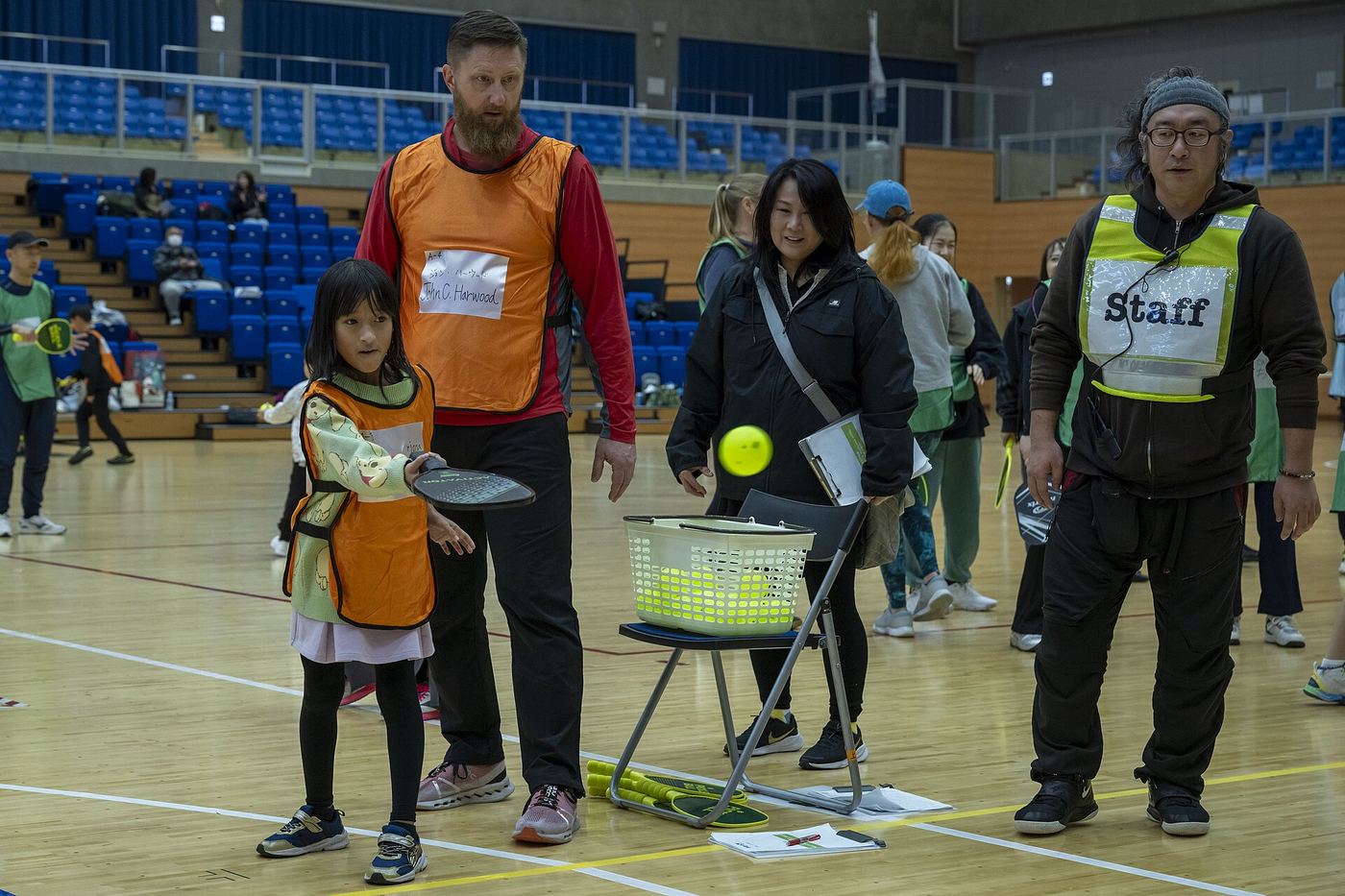 A young player lines up a shot during a beginner pickleball clinic